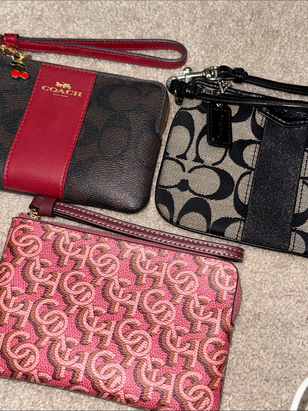 Pick one; COACH Wristlet in Brown w/ red stripe, Black w/ black stripe and Pink - Picture 2 of 2
